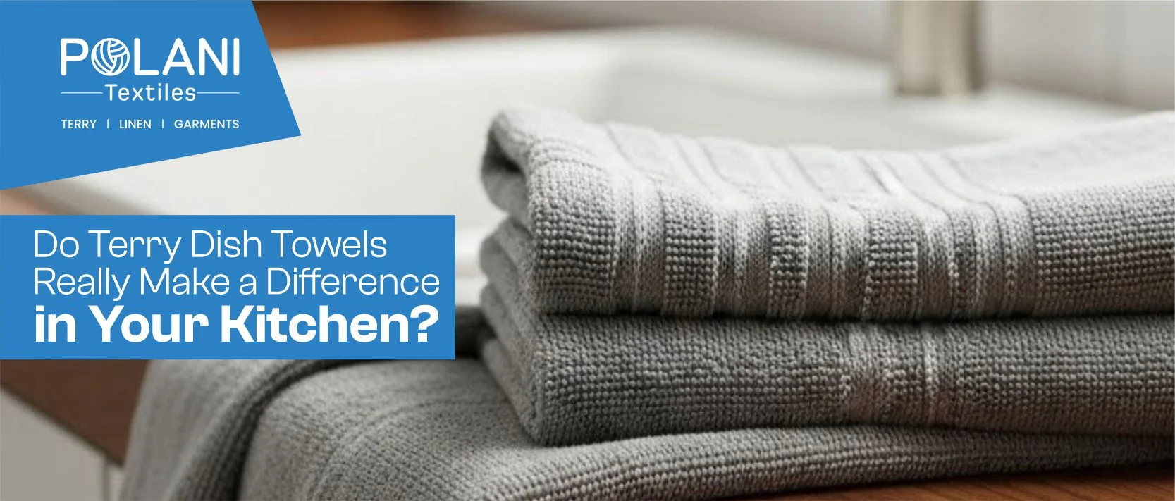 Folded gray terry towels by sink