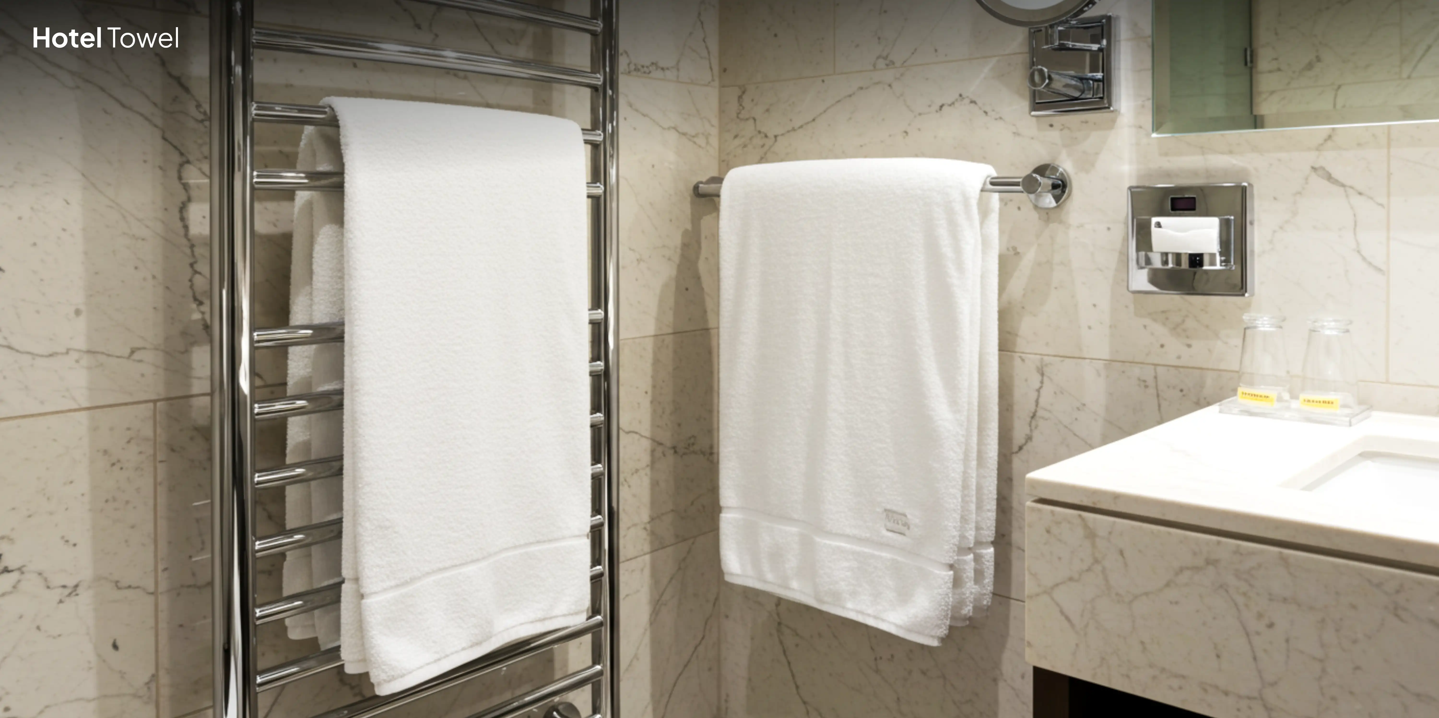 White hotel towels in modern bathroom.